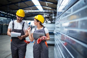 factory-workers-working-together-industrial-production-hall