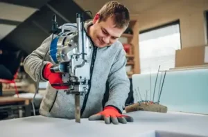 happy-craftsman-operating-foam-cutter