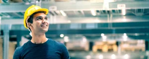 smart-engineer-man-wearing-safety-helmet-doing-stock-tick-check-cardboard-stock-product-management-factory-warehouse-background