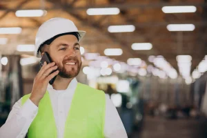young-man-engineer-working-factory-making-order-phone-1